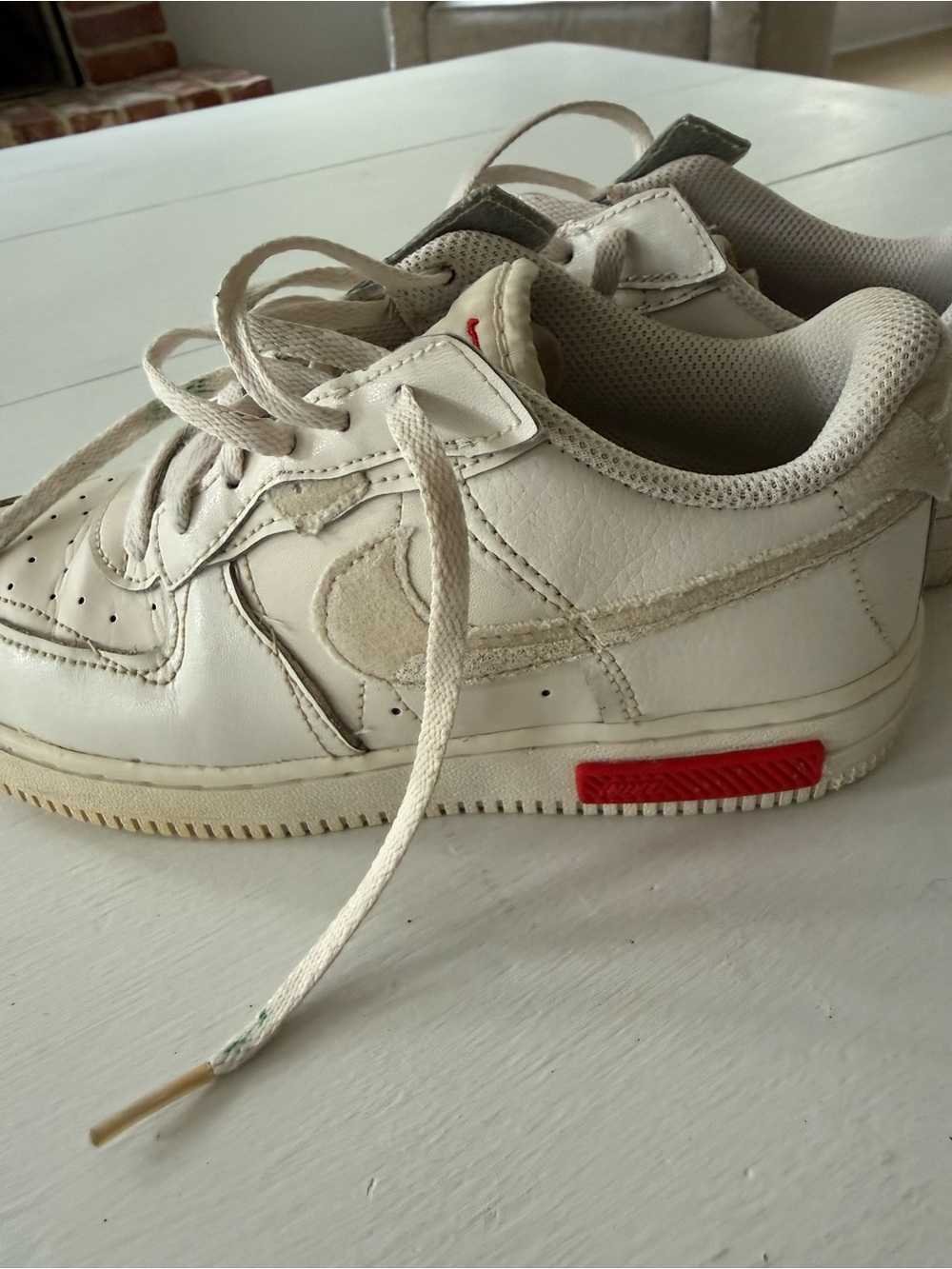 Nike Kids White Low-Top Sneakers with Red Accent